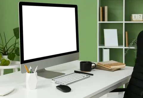 Programmer's workplace with blank computer monitor in office Stock Photos
