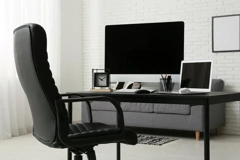 Programmer's workplace with blank laptop and computer in office Stock Photos