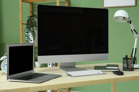 Programmers workplace with blank laptop and computer in office 스톡 사진
