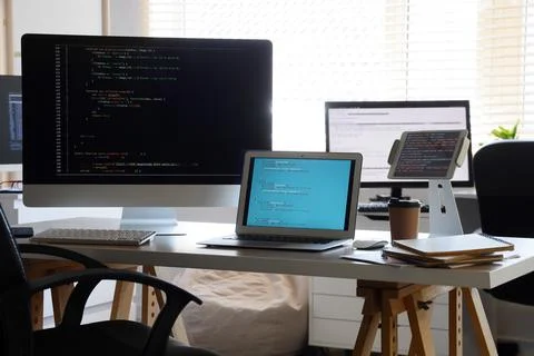 Programmer's workplace with gadgets in office 스톡 사진