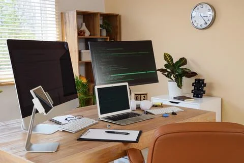 Programmers workplace with gadgets in office Stock-Fotos