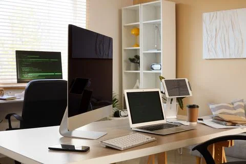 Programmers workplace with gadgets in office 스톡 사진