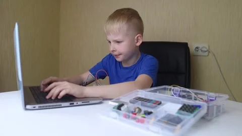 Programming for children. The boy is studying online at a robotics school for pr Stock Footage 276207386