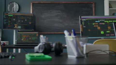 Programming Class with Laptops Displaying Software and Chalkboard Stock Footage 284424727
