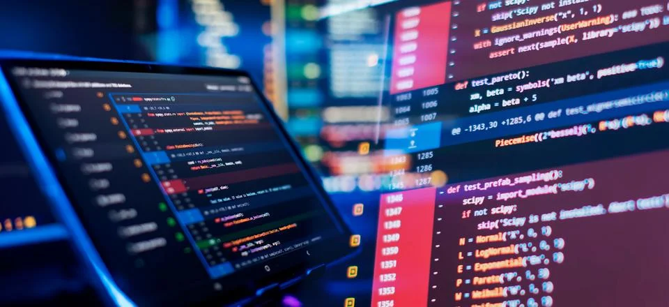 Programming code abstract screen of software developer. Working atmosphere .. Stock Photos