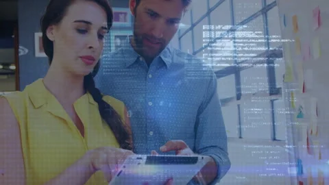 Programming code animation over business people using tablet in office Stock Footage 308901942