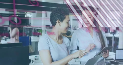 Programming code animation over two women discussing work in modern office Stock Footage 328647002