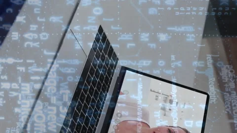 Programming code animation overlaying person video conferencing on laptop screen Stock Footage 313378733
