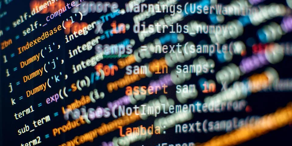 Programming code background . Software developer programming code. Stock Photos