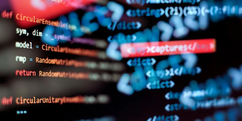 Programming code background . Software developer programming code. Stock Photos