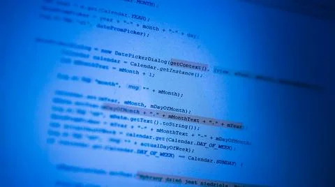 Programming code on blue monitor background. Computer language concept. Foto stock