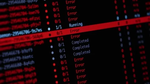 Programming code displays server deployment errors on a dark monitor, Stock Footage 346525977