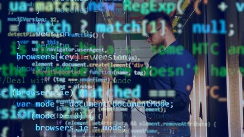 Programming code is emerging above the image of the computer engineer Stock Footage 114739363