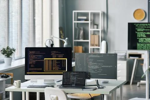 Programming Code on Multiple Screens Stock Photos