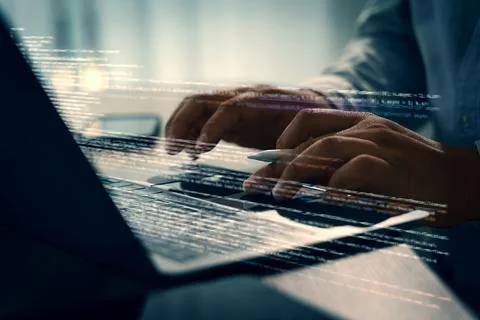 Programming code on representing person working laptop with digital code ov.. 库存照片