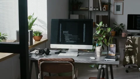 Programming Code Running on Screen of Computer Monitor on Work Desk Stock Footage 299197143