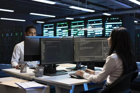 Programming, coworkers and coding at data center 写真素材
