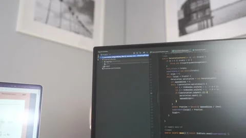 A programming integrated development environment is active while a Stock Footage 213119029