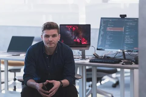 Programming. Man Working On Computer In IT Office, Sitting At Desk Writing Codes Stockfoto's