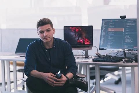 Programming. Man Working On Computer In IT Office, Sitting At Desk Writing Codes Stockfoto's
