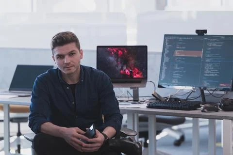 Programming. Man Working On Computer In IT Office, Sitting At Desk Writing Codes 스톡 사진