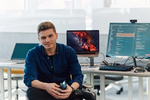 Programming. Man Working On Computer In IT Office, Sitting At Desk Writing Codes 스톡 사진