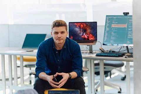 Programming. Man Working On Computer In IT Office, Sitting At Desk Writing... Stock Photos