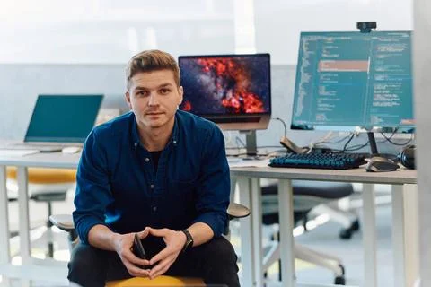 Programming. Man Working On Computer In IT Office, Sitting At Desk Writing... Stockfoto's
