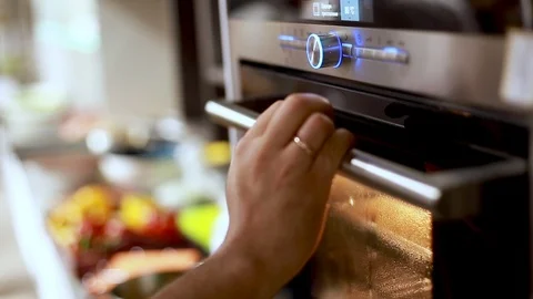 Programming modern oven for cooking food Stock Footage 113016612