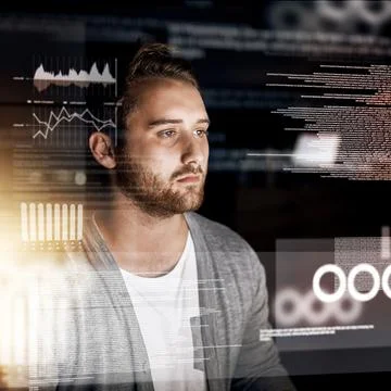 Programming the night away. a young computer programmer working on source code. 스톡 사진