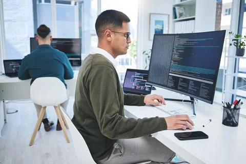 Programming, software developer and a man at computer for coding, script or Stock Photos