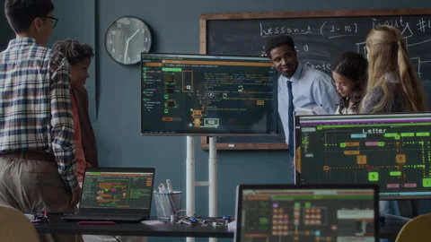 Programming Teacher Explaining Software Development to Teenage Students in Class Stock Footage 284429671