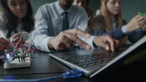 Programming Teacher Typing on Laptop Keyboard during Lesson Stock Footage 284436070
