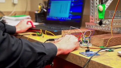 Programming technology project engineer working on developing automation system 動画素材 325842031