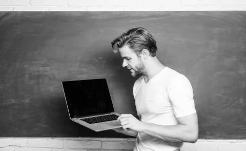 Programming web development. School teacher programming with laptop. Handsome Stock Photos