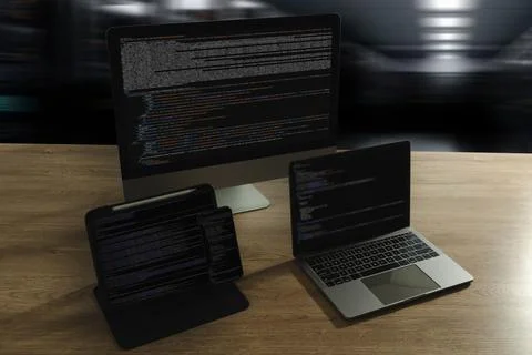 Programming workspace with code on desktop, laptop, tablet, and smartphone... 库存照片