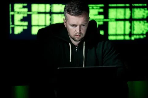 Programming at workstation shows serious work. Programming on code screen drives Stock Photos
