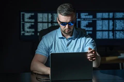 Programming at workstation shows serious work. Programming on code screen drives Stock Photos