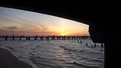 Progreso Beach sunset - Under pier - Muelle de chocolate Stock Footage 114954713