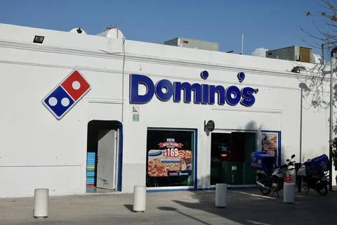 Progreso, Mexico - May 5 2022: A Domino's Pizza, also branded just as Domino's Stock Photos
