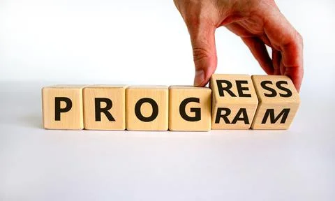 Progress and program symbol. Businessman turns wooden cubes and changes the w Stock Photos
