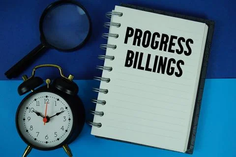 Progress Billings text written on notebook paper with alarm clock Stock Photos
