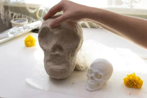 In-progress Handmade Day of the Dead Clay Skull Sculpture in a Craft Studio Stock Photos