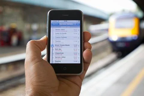 Progress of a late train displayed on smartphone Stock Photos