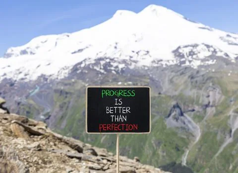 Progress or perfection words symbol. Concept words Progress is better than .. Stockfoto's