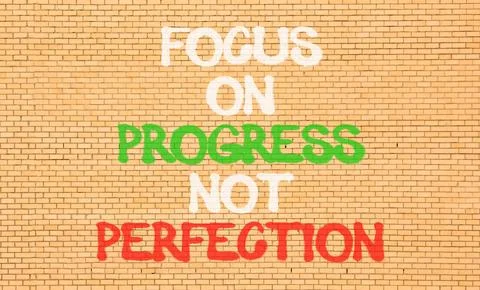 Progress or perfection words symbol. Concept words Focus on progress not pe.. Stockfoto's