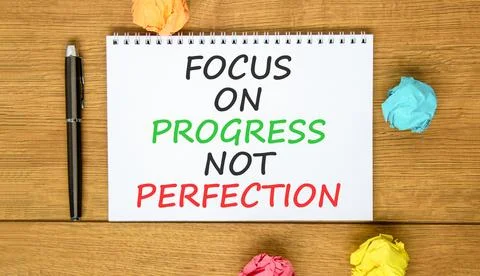 Progress or perfection words symbol. Concept words Focus on progress not pe.. Stockfoto's