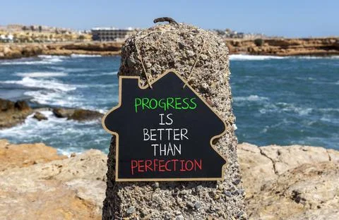 Progress or perfection words symbol. Concept words Progress is better than .. Stockfoto's