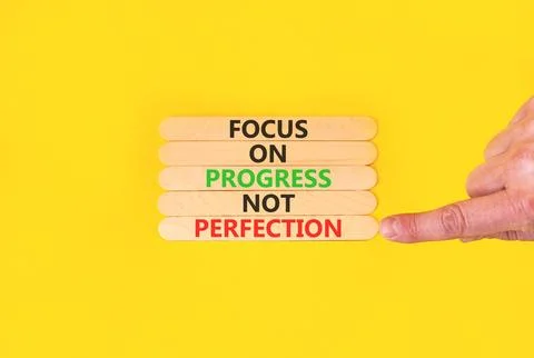 Progress or perfection words symbol. Concept words Focus on progress not pe.. Stockfoto's