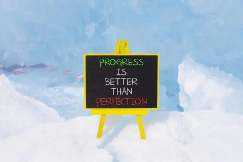 Progress or perfection words symbol. Concept words Progress is better than .. Stockfoto's